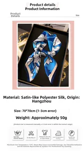 Detail view of a 70x70cm floral satin silk scarf on a black display tray