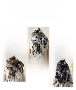 Detail view of plaid cashmere-feel scarves with fringe tassels in various colors