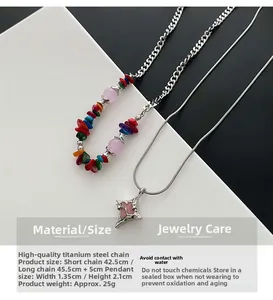 Close-up of double-layer beaded necklace with pink star pendant and titanium steel chain