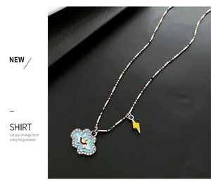 Detail of creative lightning and blue smiley cloud pendants on a multi-color beaded chain