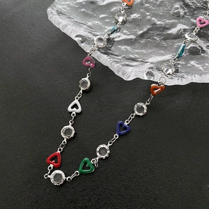 Colorful enamel heart pendant necklace with shimmering zircon gemstones on silver chain