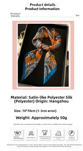 Detail of 70x70cm paisley satin silk-like scarf neatly folded in a premium black gift box