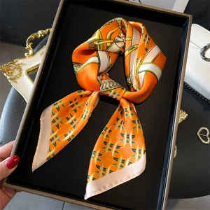 Elegant orange silk-like scarf with classic chain print and luxurious satin finish