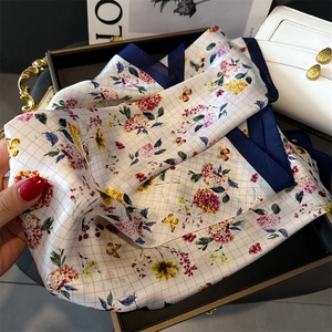 Floral butterfly print satin scarf in ivory white with navy blue border detailing