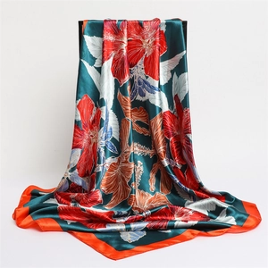 Green silk satin scarf with red floral prints and orange edges for a premium elegant look