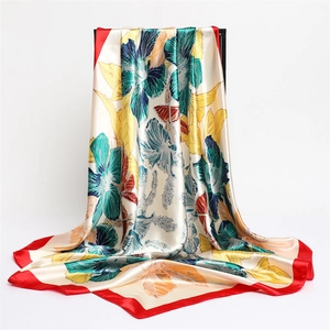 Elegant floral print satin square scarf with vibrant hibiscus pattern and red borders