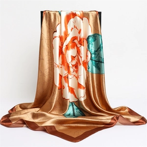 Detailed view of satin floral scarf with champagne rose print and silk-like glossy finish