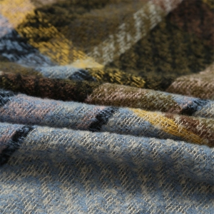 Macro d'une texture de tissu à carreaux avec des fibres de laine douces et détails en tricot