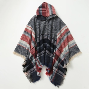 Detailed view of checkered hooded poncho with thick knit fabric and fringe tassels