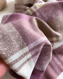 Close-up of rainbow plaid scarf showing thick brushed fabric texture and fringe details