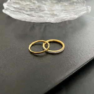 Two-piece gold titanium steel ring set with hammered texture and pavé zircon stones