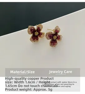 Detail of pink flower stud earrings with champagne beads and gold stamen accents