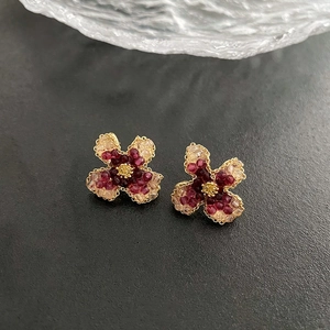 Handcrafted luxury pink beaded flower stud earrings with elegant gold-tone center