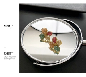 Detailed view of vintage flower earrings with multicolored petals and gold-tone metal base