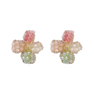 Elegant floral stud earrings featuring colorful beads in a vintage gold-toned setting