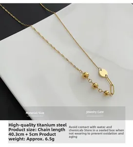 Detail of titanium steel necklace with gold spheres and technical size specifications