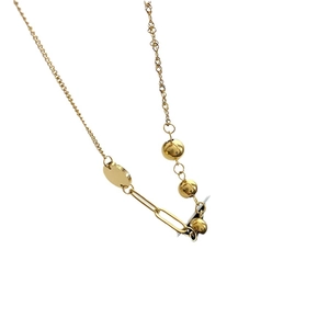Asymmetric gold titanium steel necklace with metallic spheres and spliced chain design