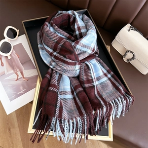 Close-up of classic burgundy and blue plaid cashmere-feel scarf with long fringes