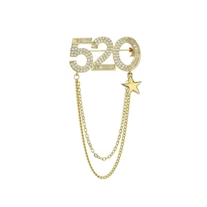 Broche 520 élégante dorée avec strass et pampilles en forme d'étoile pour femmes