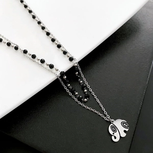 Double-layer titanium steel necklace with elephant pendant and black beaded chain