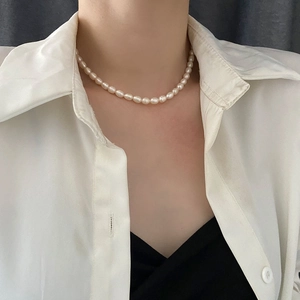 Elegant baroque freshwater pearl choker necklace shown on model for a trendy summer style