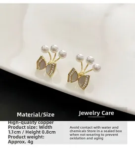 Detailed macro view of bow earrings with pearls and dimensions marked at 1.1cm by 0.8cm
