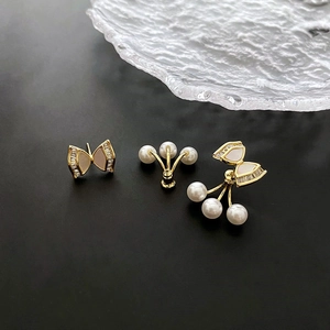 Elegant gold bow earrings with mother of pearl and detachable pearl drops for women
