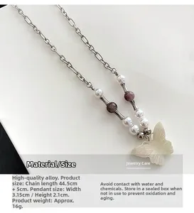 Detail view of butterfly pendant necklace with size dimensions and 44.5cm chain length