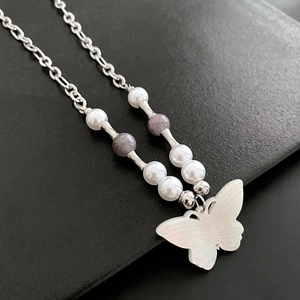 Vintage butterfly pendant necklace with white natural stones and silver chain on black leather