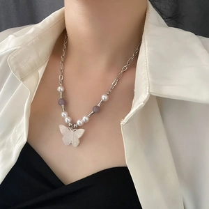 Vintage butterfly pendant necklace with natural stone beads and silver chain on model