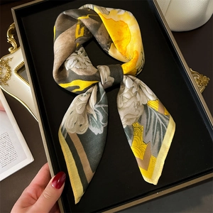 Elegant floral silk square scarf with geometric patterns in a luxury gift box