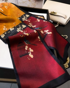Detail of elegant Chinese style floral silk scarf featuring bird and flower prints