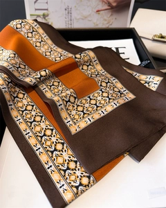 Detailed view of the 100% polyester fabric texture and geometric pattern of the skinny scarf