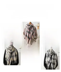 Detail of plaid cashmere-feel scarf with fringes in grey, pink and beige tones