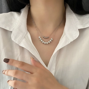 Elegant double-layered silver necklace with polished beads and gray pearls for women
