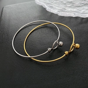 Polished titanium steel bracelets with ball clasp in gold and silver finishes