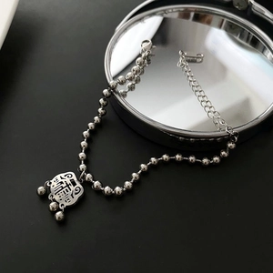 Silver vintage lock charm bracelet in titanium steel with polished beads and reflective finish