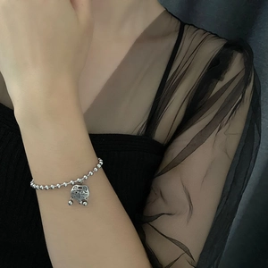 Silver bead bracelet with a traditional Chinese Ruyi lock pendant and Fu symbol charm