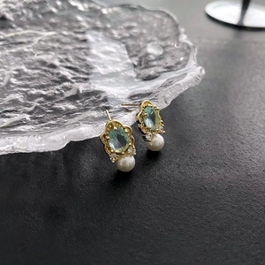 Vintage light blue micro-pave stud earrings with gold plating and teardrop pearl charms