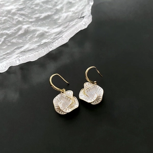 Elegant gold-tone camellia flower drop earrings with white shell-like spiral petals