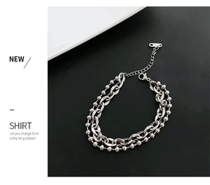 Dettaglio del bracciale a doppia catena cubana argento con marchio S.STEEL e chiusura aragosta
