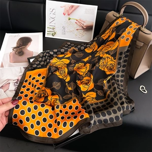 Elegant 70cm polka dot silk scarf with yellow rose print and orange color block detail