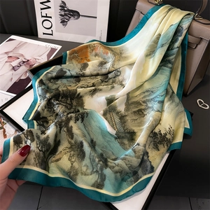 Silk scarf with Chinese ink landscape painting on elegant leather bag background