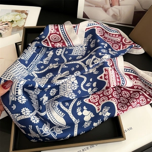 Detailed shot of retro silk scarf in elegant gift box with horse and rabbit patterns
