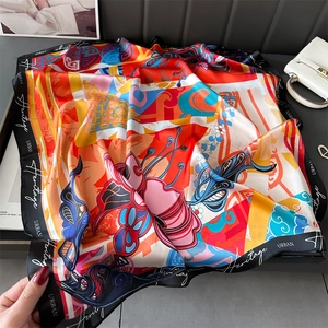Vibrant 70cm silk scarf with butterfly and cloud patterns in a premium draped display