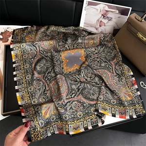 Luxurious paisley silk scarf with vintage palace patterns on premium black background