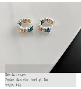 Detail view of colorful rectangle-cut zircons set in a silver hoop earring for women