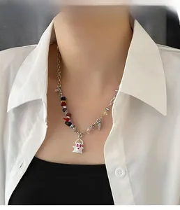 Detail shot of the white ghost pendant with colorful gravel beads on a silver chain