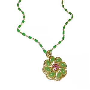 Lucky flower necklace with gold rotating petals and green emerald jade stones