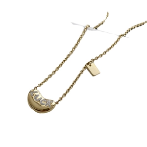 Minimalist gold bean necklace with luck letters pendant on a delicate cable chain